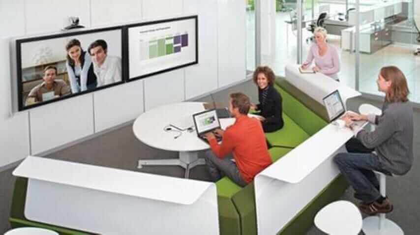 Green huddle room with a wall screen, revised view